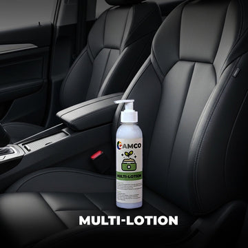 GAMCO Store Multi-Lotion bottle placed on black leather car seats, designed for nourishing and protecting various materials.